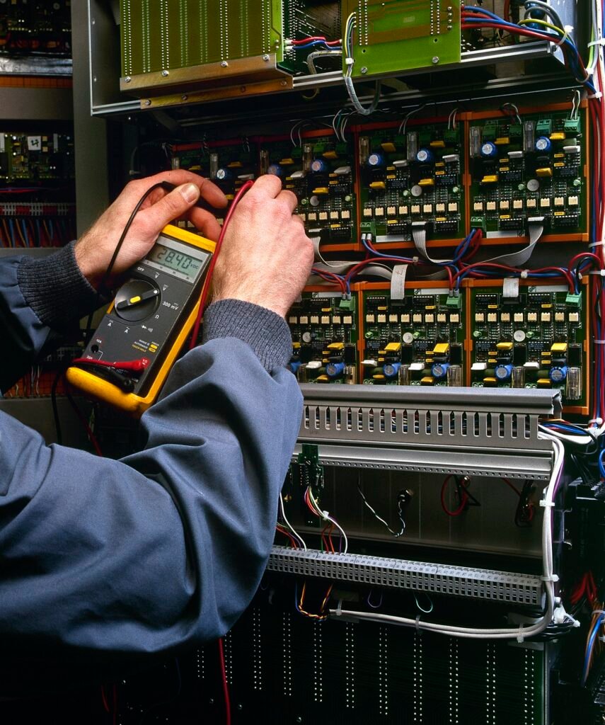 electrician testing industrial machine